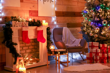 Interior of room with beautiful decorated Christmas tree at night