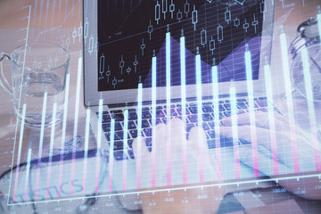 Multi exposure of market chart with man working on computer on background. Concept of financial analysis.