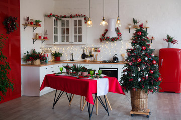 Modern Kitchen Interior with Island, Sink, Cabinets in New Luxury Home Decorated in Christmas Style.
