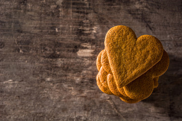 Heart shaped cookie on wooden table with copy space. Valentine's Day and Mother's Day concept.	