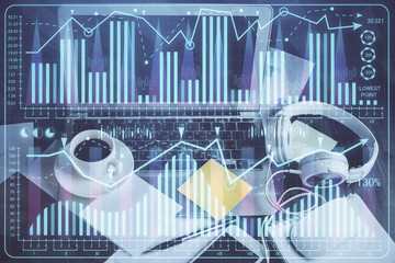 Double exposure of chart and financial info and work space with computer background. Concept of international online trading.