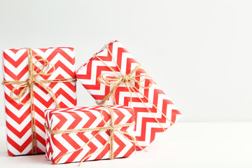 Fototapeta premium Gift boxes with ropes on white background