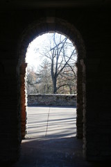 Looking Out Through a Stone Arched Walkway