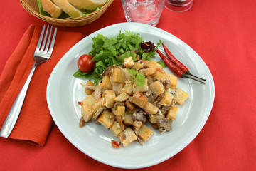 beef and potatoes on a plate