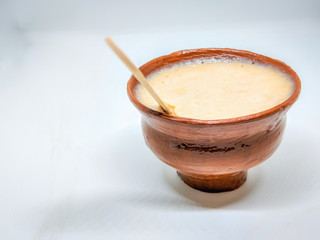 Sweet curd or sweet dahi in hindi, served in earthen pot, selective focus is used.