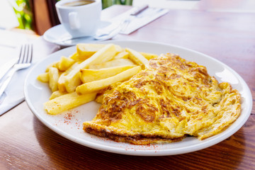omelet with ham tomato and green french fries