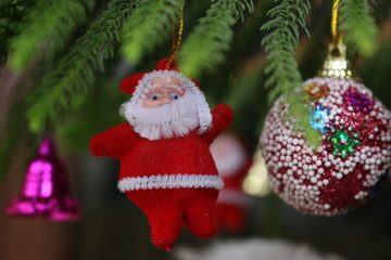 Christmas tree decorated with toy of Santa Clause to celebrate christmas