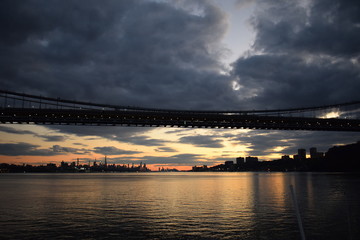 Under the bridge at sunset
