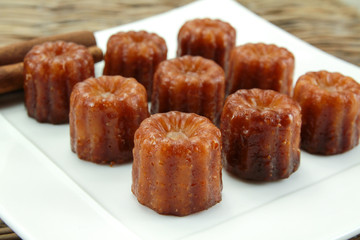 several cannelés on a plate