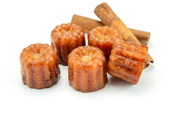 several cannelés on a white background