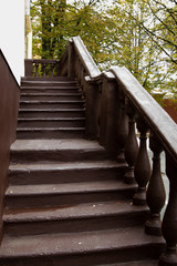 stone staircase, entrance to the house, natural railing, warm pine, the concept of the city