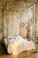 New Year design interior of beautiful bedroom in gray tones. Traditional winter holidays Christmas / New Year.