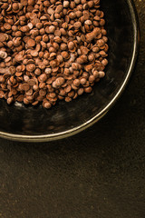 chocolate drops (black or milk chocolate, sweet ingredient) menu concept. food background. copy space. Top view