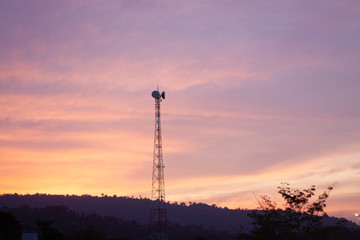 high voltage tower at sunset
