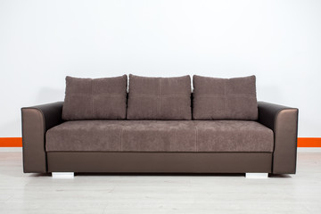 brown leather sofa on a white background