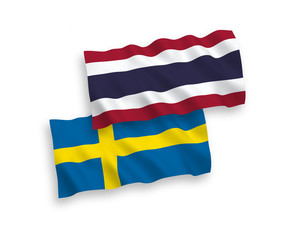 Flags of Sweden and Thailand on a white background