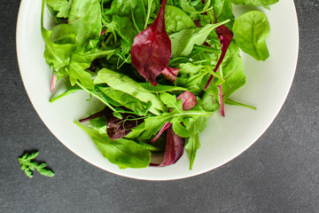 Healthy salad, leaves mix (mix micro greens, arugula, onion, other ingredients). food background....