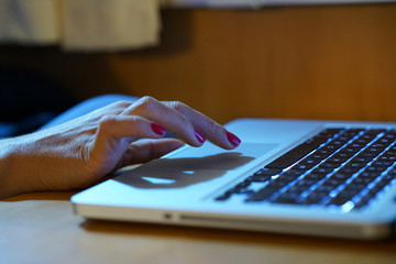 Hands working on the computer keyboard