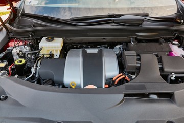 Obraz na płótnie Canvas Engine bay of a car, hybrid system under the hood
