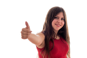 Caucasian young girl doing ok gesture with her finger