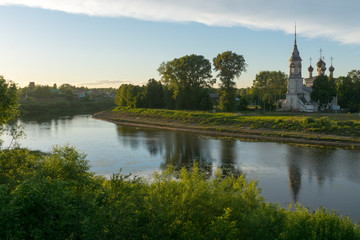 Fototapeta na wymiar Sretenskaya Church on the river bank in Vologda