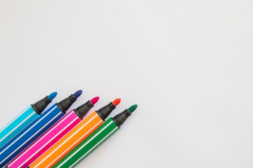 Colored felt pens, white background