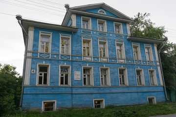 Fototapeta na wymiar Two-storey wooden house in Vologda
