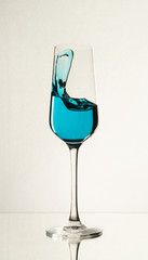 Splash of water in a wine glass