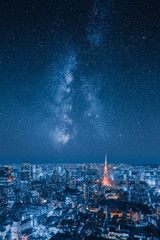 Epic cityscape image of city skyline at night with stars of milky way galaxy on the sky - 303637303