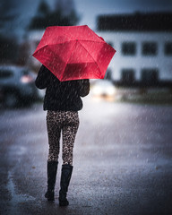 Young Girl With Red Umbrella Walking in Rain