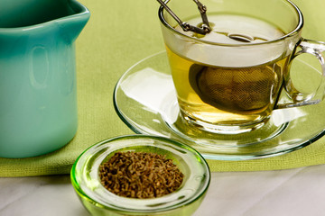 cup of fennel tea with crackers
