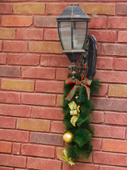 Decoration of the lantern on the street Christmas needles twigs and toys.