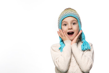 Smiling girl in the winter look wearing funny warm hat