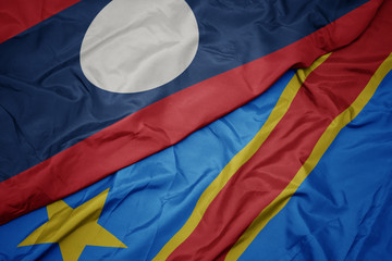 waving colorful flag of democratic republic of the congo and national flag of laos.
