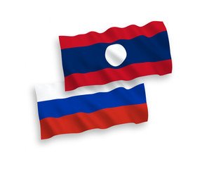 Flags of Laos and Russia on a white background