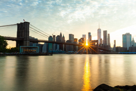 View of Brooklyn Bridge with Manhattan skyline at sunset, Manhattan, New York City, New York State, United States