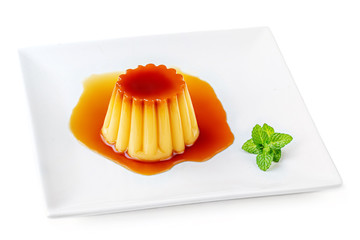Cream  caramel, flan, or caramel pudding with sweet syrup  on a plate  isolated on white...