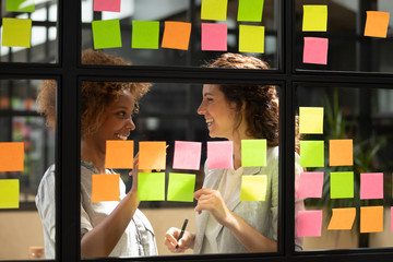 African american manager discussing project details with skilled scrum master.