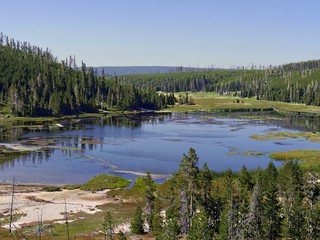 Fototapeta na wymiar Breathtaking view of Nymph Lake along the road north of Norris Geyser Basin at Yellowstone National Park.