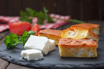 Homemade, freshly baked cornbread with cheese on dark background. Proja - bread  made of corn flour. Healthy food.