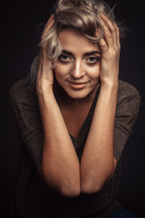 portrait of a young beautiful girl on a black background