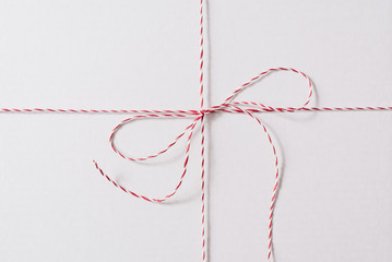 White Red Christmas Rope Bow on the White Background.