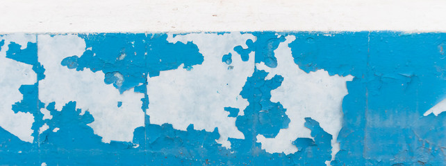 Texture of old peeling paint, vintage graffiti background, it's time to make repairs, cracked paint texture.  Clipart, white, blue old paint, panoramic photo