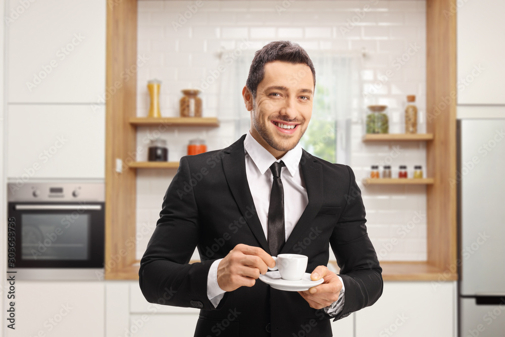 Wall mural businessman with a cup of espresso coffee