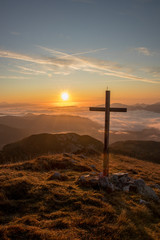 Sunlit cross on top of a mountain, Bohinj