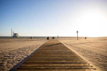 A beach pier with people