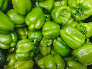 Plakat A lot of green bell pepper in the super market