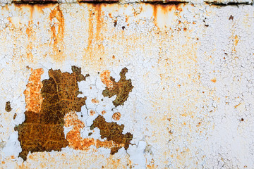 Rust, peeling paint. Cracked paint on the metal. The background on the topic of rust. Corrosion. The texture is seamless.