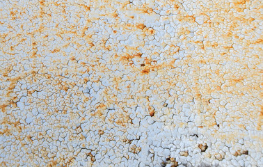 Rust, peeling paint. Cracked paint on the metal. The background on the topic of rust. Corrosion. The texture is seamless.
