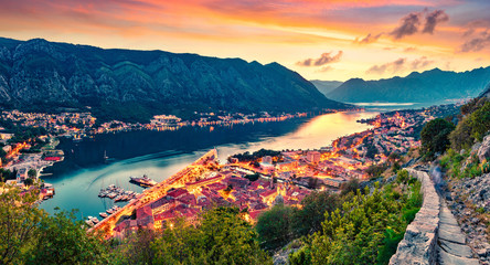 Great summer sunset in Kotor port. Aerial evening view of Kotor bay and Old Town from hill of ...